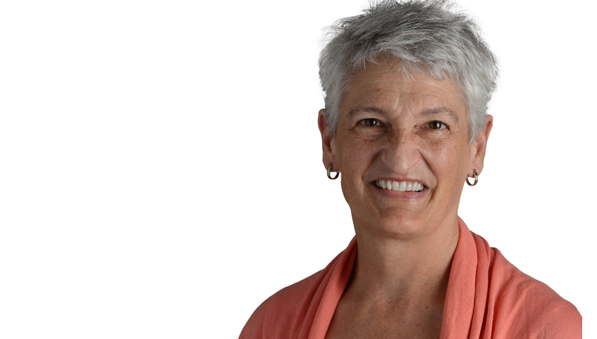 Close up of woman with short grey hair smiling