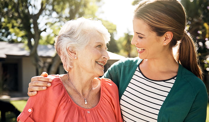 Breast cancer survivor smiling with her daughter