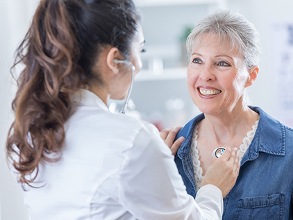 Doctor visiting with patient.