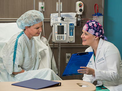 KU Cancer Center physician meeting with patient prior to cancer treatment.