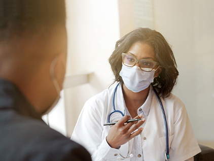 Person sitting with doctor getting a second opinion