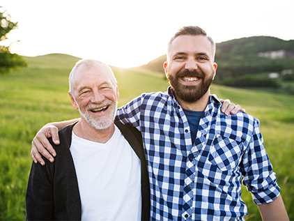 Father and son smiling.