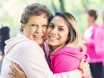 Grandma and granddaughter smiling.