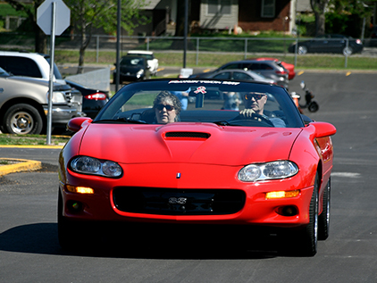 The Fosters driving in car.