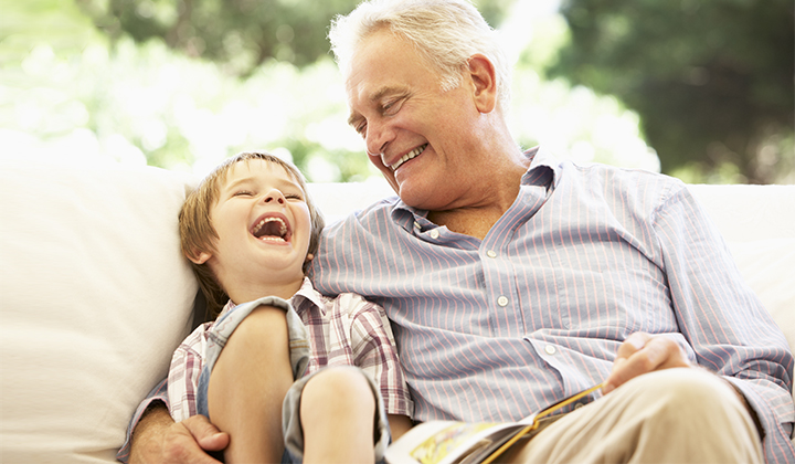 Grandpa laughing with grandson.