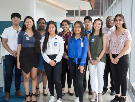 Group of students standing together smiling at the camera