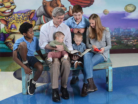 Children's Mercy patients looking at a book.