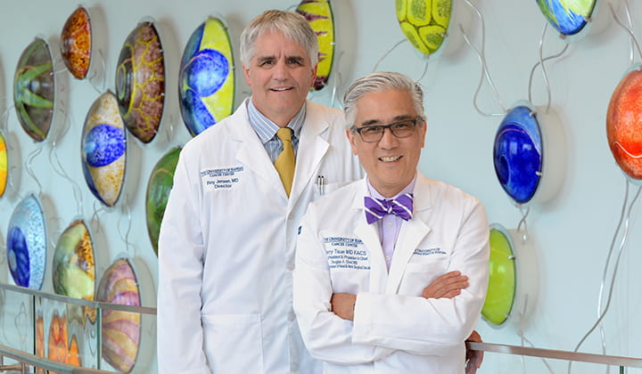 Cancer center leaders Roy Jensen and Terry Tsue.