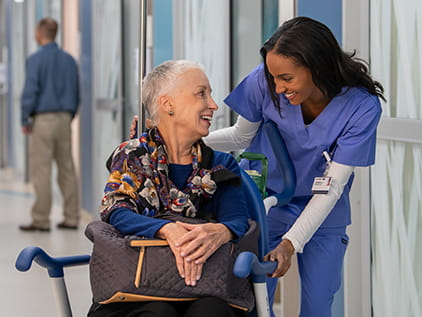 Nurse with patient in wheelchair.