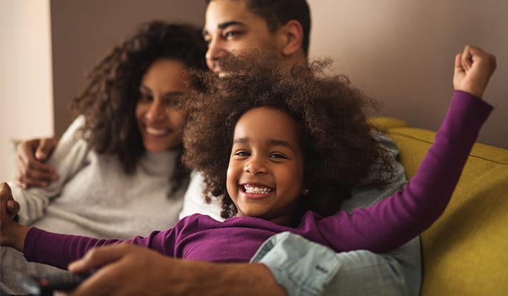 Happy young girl with family.