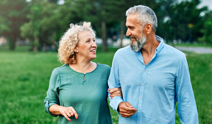 A couple walking in a park