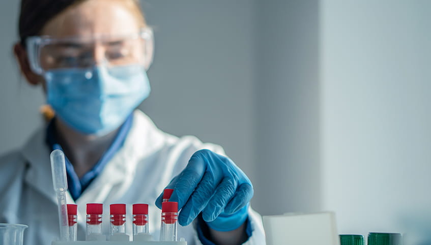 Doctor using test tubes