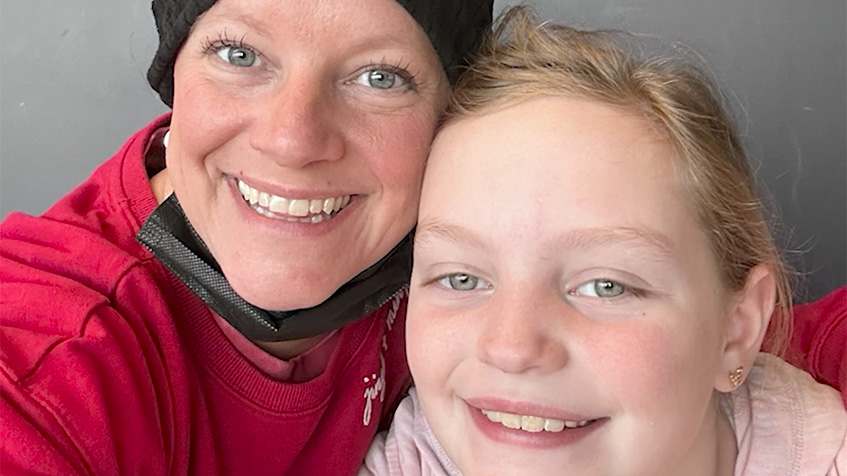 Emily Schoeb smiling with her daughter