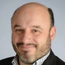 professional headshot of a person smiling at the camera