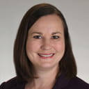 professional headshot of a person smiling at the camera