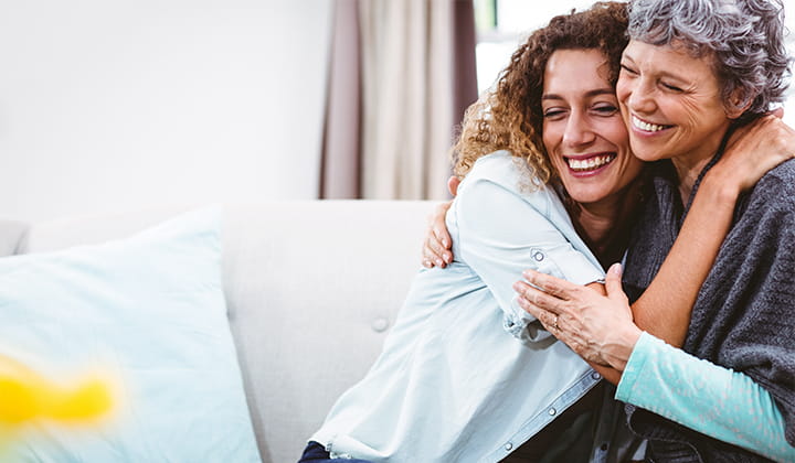 Happy mother and daughter embracing