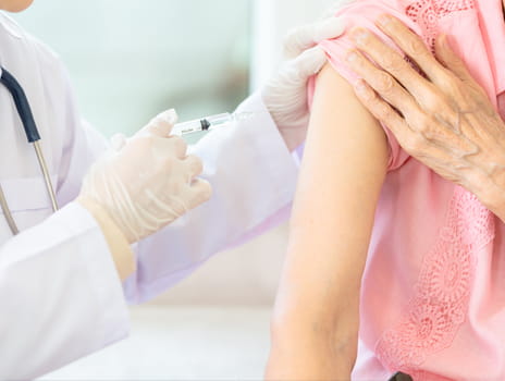 Doctor Giving Vaccine to Patient