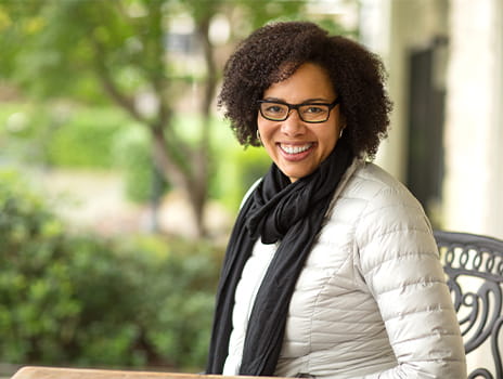 Smiling woman sitting outside