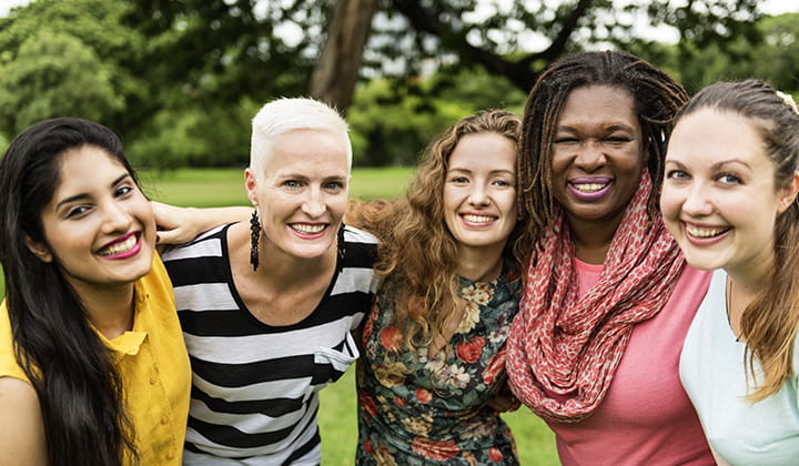 Group of happy women together celebrating after successful cancer treatment