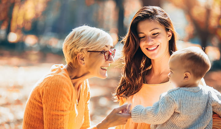 Happy grandma with daughter and grandchild.