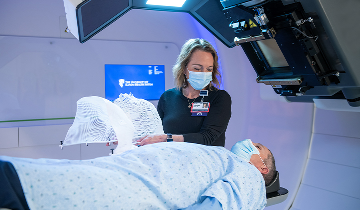 Nurse preparing patient for Proton Therapy Treatment